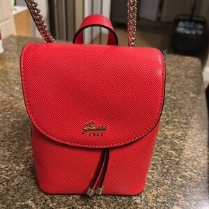 Guess Red Backpack with Chain Strap and Flap Closure